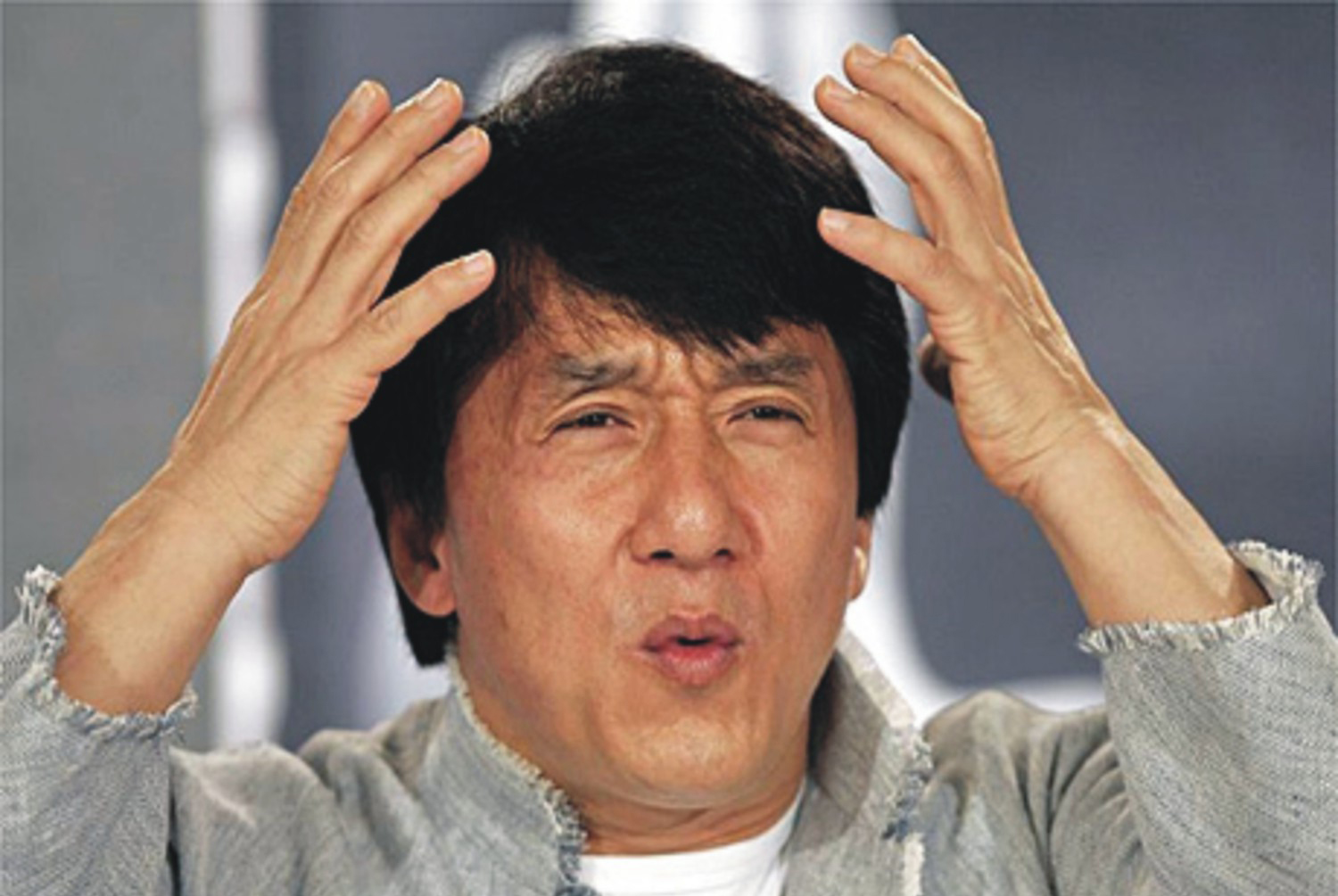 Jackie Chan making a confused expression
